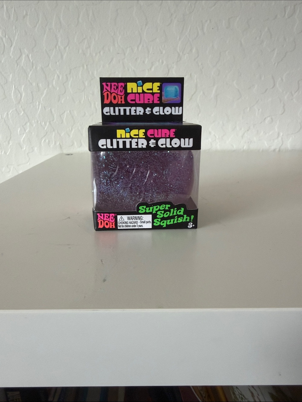 NEW unopened NeeDoh Nice Cube Glitter & Glow. Color purple.